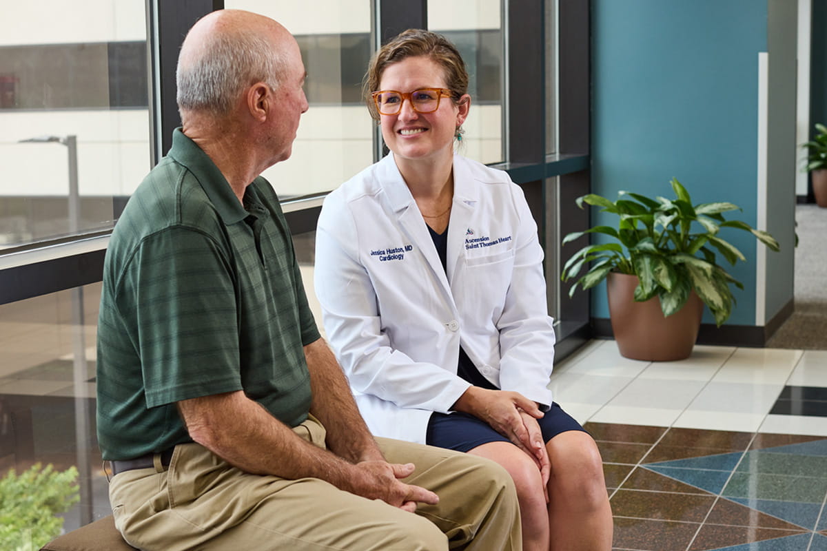 Heart failure specialist Dr. Huston talks with a male patient at Ascension Saint Thomas Heart in Nashville, TN.